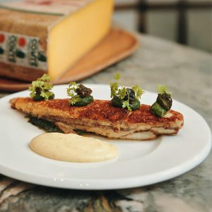 Lenguado con queso Comté, caracoles y espinacas X Sven Ornelis
